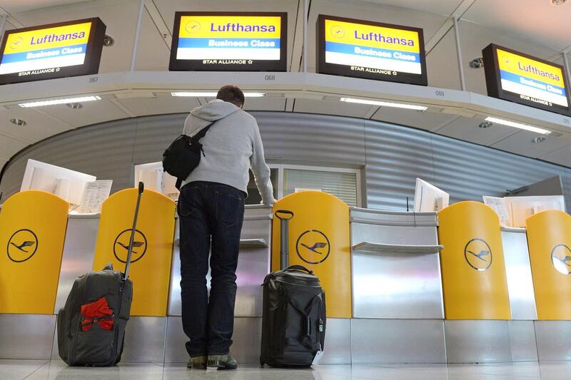A man checks in at a Lufthansa counter at the airport in Munich, Germany, 20 October 2014.  Lufthansa long-haul pilots announced they would be joining part of the industrial action planned by their short- and medium-haul colleagues over changes to their retirement plans. The long-haul pilots would walk out from 6am (0400 GMT) on 21 October to 11.59 pm, the Cockpit union said. Short- and medium-haul pilots said on October 19 they would stop work from 1pm (1100 GMT) October 20 until 11.59pm October 21. Long-haul services affected would include all Lufthansa flights on Airbus A380, A340 and A330 planes, as well as any national flights on Boeing 747s, the union said.  Andreas Gebert / EPA