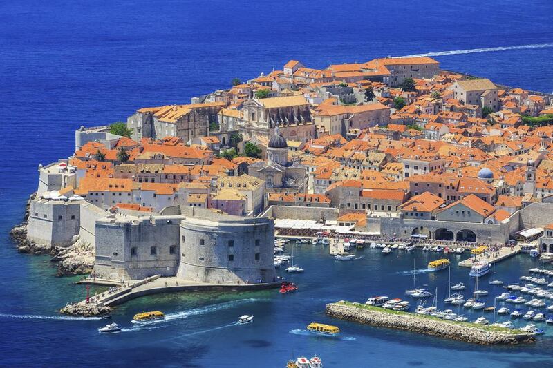 The city of Dubrovnik, with its terracotta rooftops and medieval walls circling its Old Town, juts out into the Adriatic Sea. iStockphoto.com