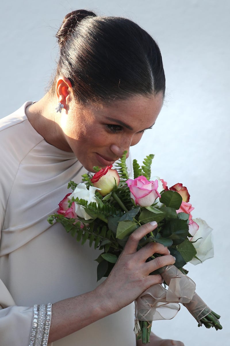 Meghan receives a posy. EPA