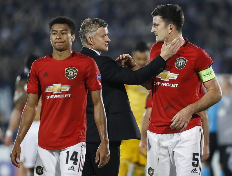 BELGRADE, SERBIA - OCTOBER 24: Manager Ole Gunnar Solskjaer (C) of Manchester United celebrate with Harry Maguire (R) and Jesse Lingard (L) after the UEFA Europa League group L match between Partizan and Manchester United at Partizan Stadium on October 24, 2019 in Belgrade, Serbia. (Photo by Srdjan Stevanovic/Getty Images)