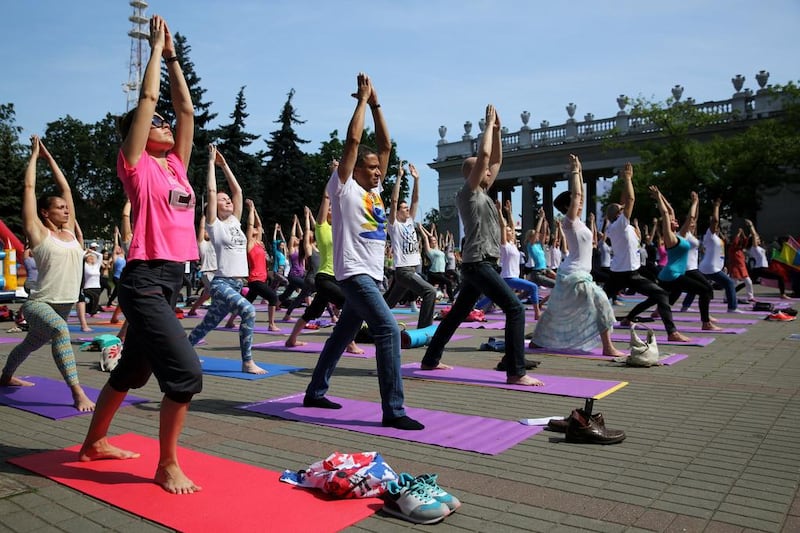 Yoga enthusiasts practice yoga on International Yoga Day in the central Gorky park in Minsk, Belarus. Tatyana Zenkovich / EPA