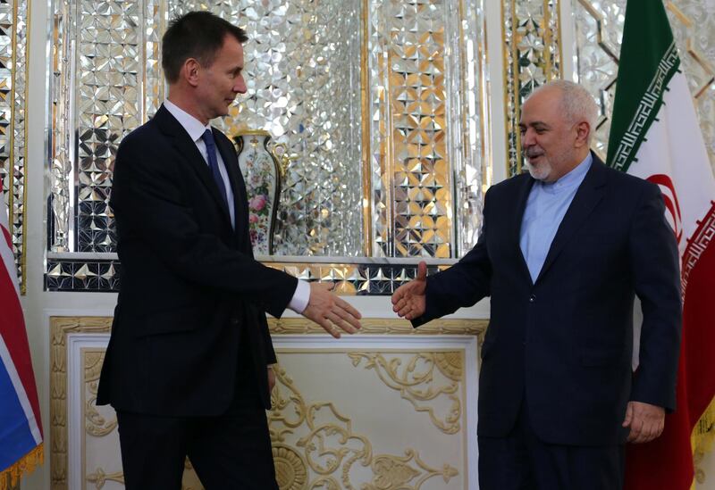 epa07176752 Iran's Foreign Minister Mohammad Javad Zarif (R) greets Britain's Foreign Secretary Jeremy Hunt in Tehran, Iran, 19 November 2018. Hunt is the first European foreign minister to visit Tehran since US President Donald Trump pulled out of the 2015 nuclear deal between Iran and several world powers in May and re-imposed sanctions on 05 November.  EPA/STRINGER