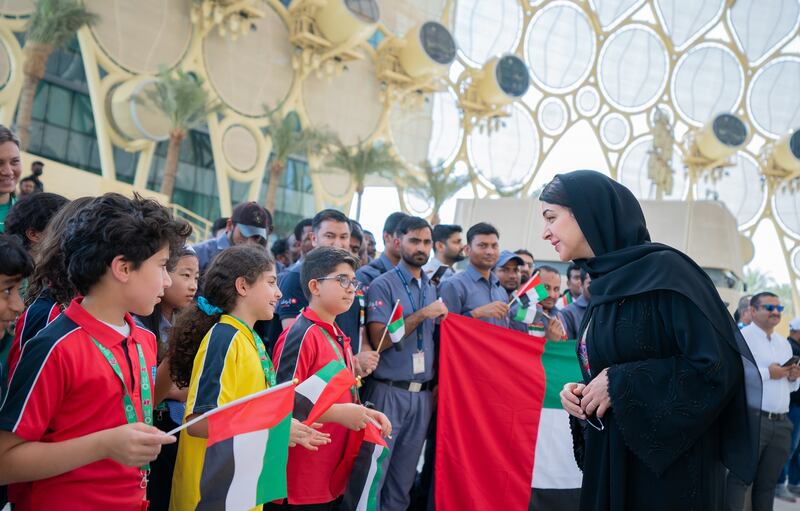 Reem Al Hashimy, Minister of State for International Co-operation, greets schoolchildren at Expo City Dubai on UAE Flag Day. Photo: Expo City Dubai