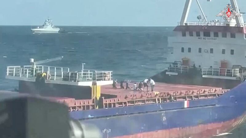 A video still purportedly shows crew members kneeling on the deck of the Sukru Okan on the Black Sea on August 13. Russian Defence Ministry / Reuters