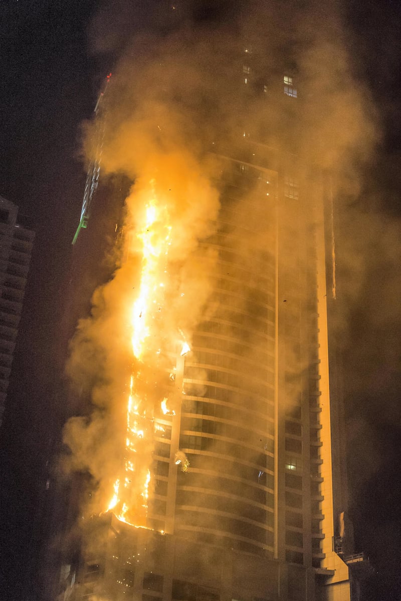 DUBAI. UNITED ARAB EMIRATES, 04 AUGUST 2017. A massive fire rips through The Marina Torch tower's southern corner. (Photo: Antonie Robertson) Journalist: None. Section: National.