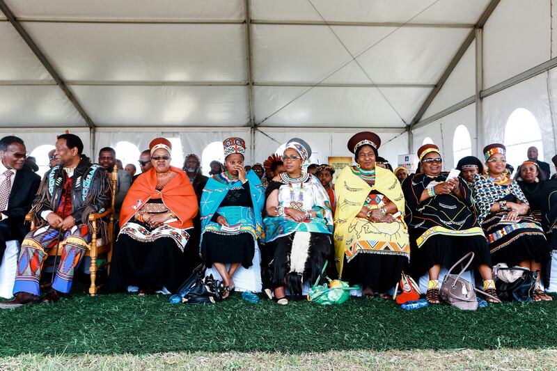 From left, Prince Mangosuthu Buthelezi, the late King Goodwill, Zulu queens Sibongile Dlamini, Buhle Mathe, the late Mantfombi Dlamini, Thandekile Ndlovu, Nompumelelo Mamchiza and Zola Mafu attend a Zulu festival in 2013. AFP