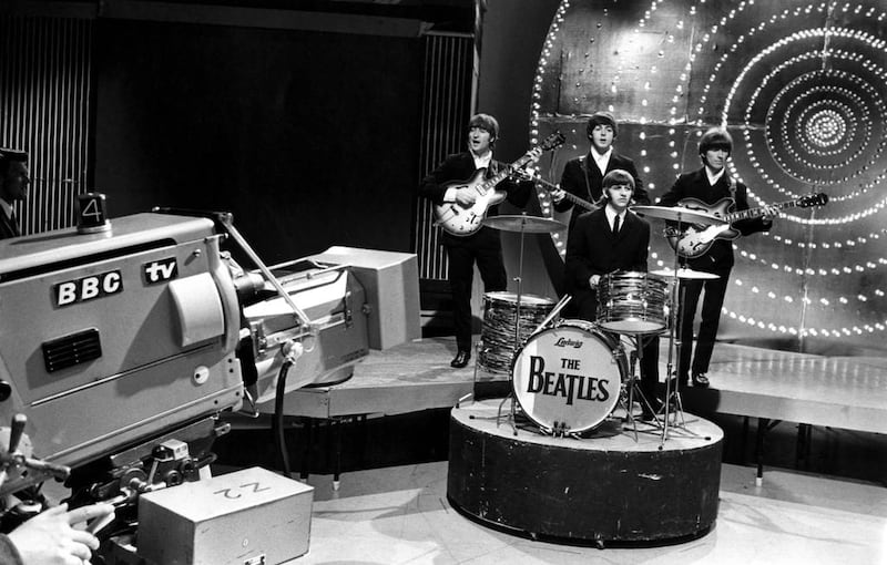 Left to right, John Lennon, Paul McCartney, Ringo Starr and George Harrison perform Paperback Writer at the BBC television studios in London in the mid-1960s. Cummings Archives / Redferns

