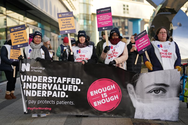 Nurses and ambulance staff on the picket line outside Queen Elizabeth Hospital in Birmingham on Monday, February 6. PA