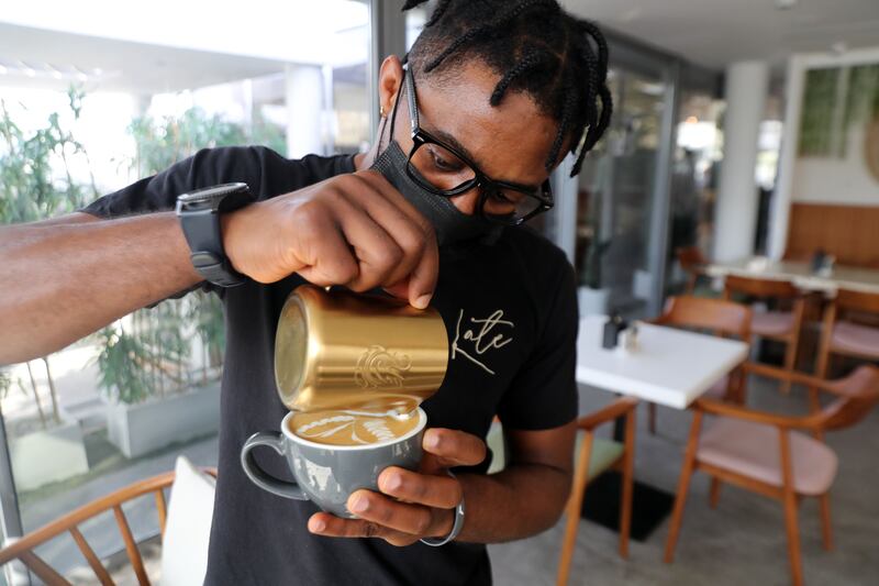 Sylvester Femi Okeowo is a latte artist at Late Lounge in Dubai.