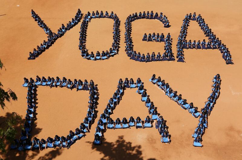 School children sit as they form the word 'Yoga Day' on the International Yoga Day in Chennai, India. P Ravikumar / Reuters