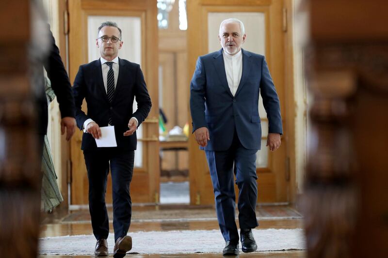 Iranian Foreign Minister Mohammad Javad Zarif, right, and his German counterpart Heiko Maas walk to a press conference after their talks, in Tehran, Iran, Monday, June 10, 2019. Iran's foreign minister warned the U.S. on Monday that it "cannot expect to stay safe" after launching what he described as an economic war against Tehran, taking a hard-line stance amid a visit by Germany's top diplomat seeking to defuse tensions. (AP Photo/Ebrahim Noroozi)