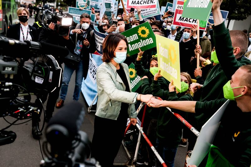 Supporters welcome the Greens' Annalena Baerbock as she arrives for the live election debate in Berlin. Photo: EPA