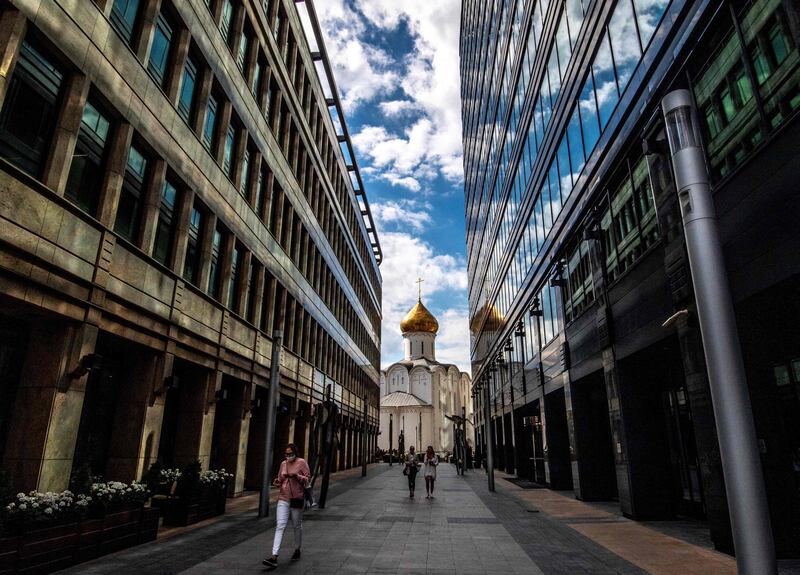 A woman walks along a street in central Moscow, Russia. AFP