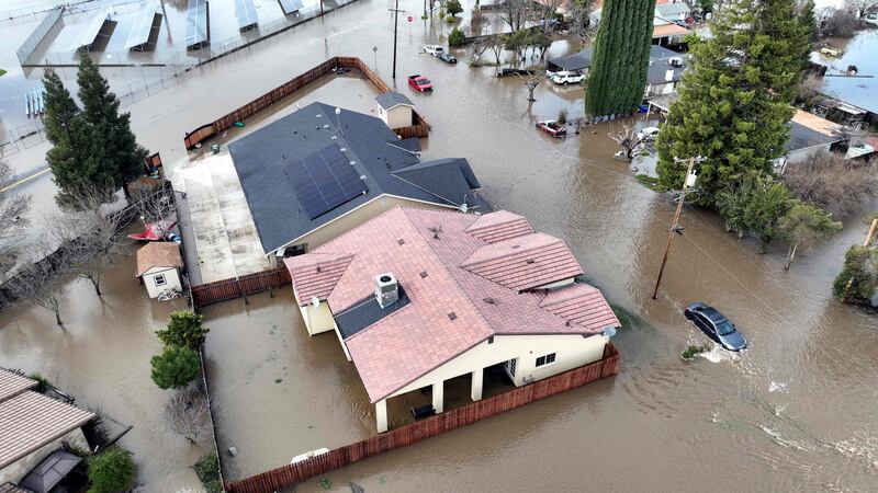 Homes flooded in Planada as the storm sequence continues.  AFP