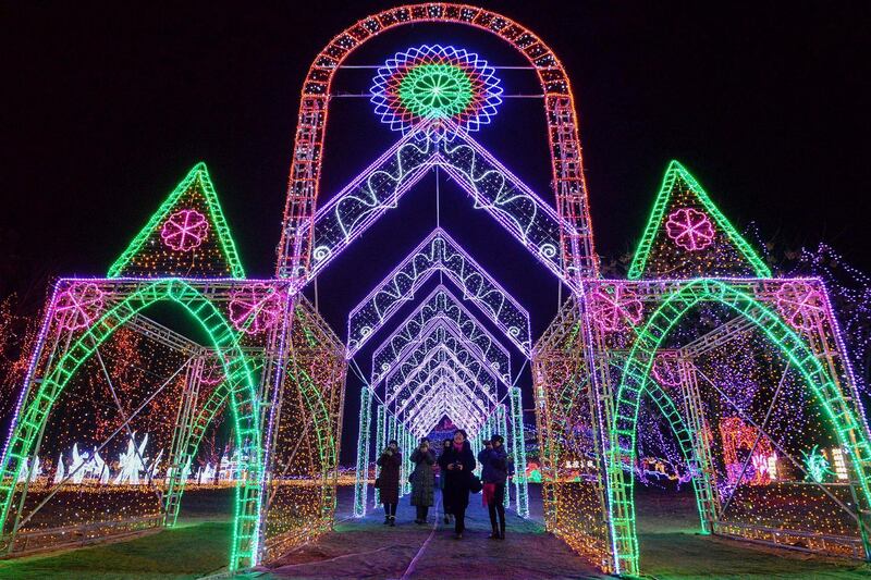 People visit a lighting display in Handa, Hebei, China. AFP