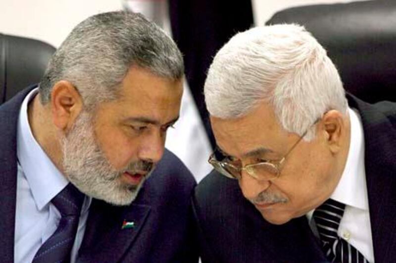 epa02705269 (FILE) A file photograph dated 18 March 2007 shows Palestinian President Mahmoud Abbas (R) with Palestinian Prime Minister Ismail Haniyeh during a government cabinet meeting in Gaza City in the Gaza Strip. After years of dispute, rival Palestinian factions Hamas and Fatah signed a reconciliation agreement mediated by Egypt in Cairo on 27 April 2011, Fatah officials confirmed. The details of the surprise agreement would be revealed in a press conference in Cairo later on Wednesday, Fatah official Azzam al-Ahmad, who led his groupÔs delegation in the talks said. The deal creates a timeframe for legislative and presidential elections and calls for the formation of an interim government, pan
Arab network Al Arabiya reported earlier.  EPA/ALI ALI
