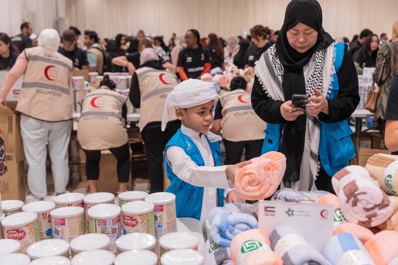 Volunteers pack aid for Palestinians in Gaza at Al Rimal Hall in Dubai on Saturday. All photos: Antonie Robertson / The National
