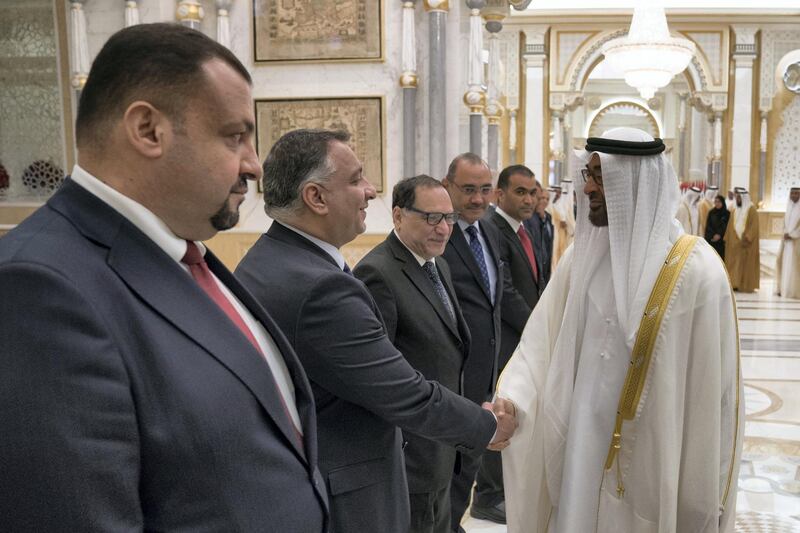 ABU DHABI, UNITED ARAB EMIRATES - November 12, 2018: HH Sheikh Mohamed bin Zayed Al Nahyan Crown Prince of Abu Dhabi Deputy Supreme Commander of the UAE Armed Forces (R), greets a delegation member accompanying HE Dr Barham Salih, President of Iraq (not shown), during a reception held at the Presidential Palace. 

( Hamad Al Kaabi / Ministry of Presidential Affairs )?
---