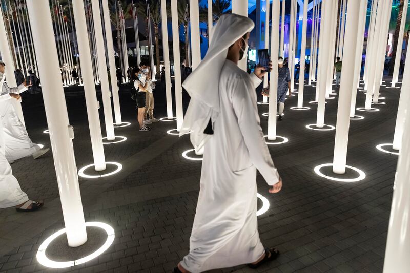 As the sun sets on another day at Expo 2020, visitors enjoy the activities. Antonie Robertson / The National