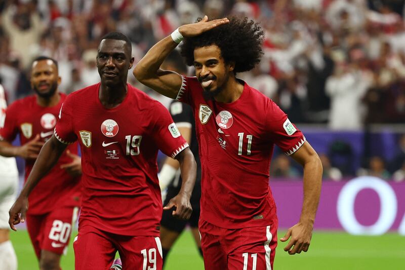Qatar's Akram Afif celebrates after scoring their second goal against Jordan from the penalty spot. Reuters