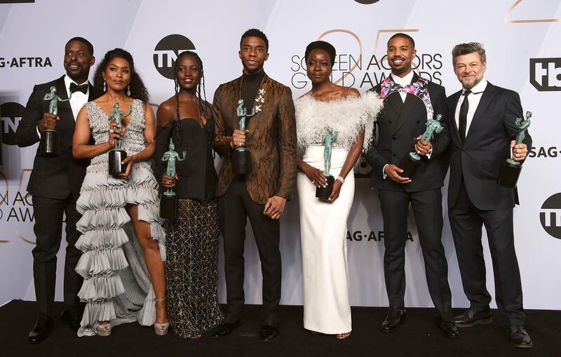 Sterling K. Brown, from left, Angela Bassett, Lupita Nyong'o, Chadwick Boseman, Danai Gurira, Michael B. Jordan, and Andy Serkis pose with the award for outstanding performance by a cast in a motion picture for "Black Panther" in the press room at the 25th annual Screen Actors Guild Awards at the Shrine Auditorium & Expo Hall on Sunday, Jan. 27, 2019, in Los Angeles. (Photo by Jordan Strauss/Invision/AP)
