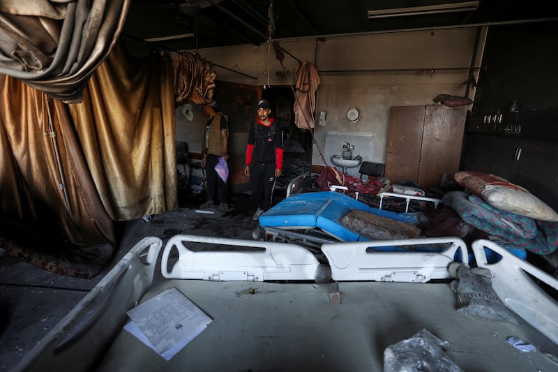 Palestinians inspect a destroyed ward inside the hospital. Reuters