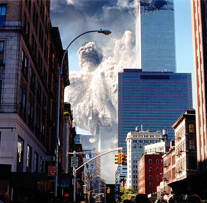 The south tower of the World Trade Center collapses sending dust and smoke into the streets 11 September, 2001, in New York. Two planes crashed into the towers which later collapsed.  AFP PHOTO/Aaron MILESTONE (Photo by AARON MILESTONE / AFP)