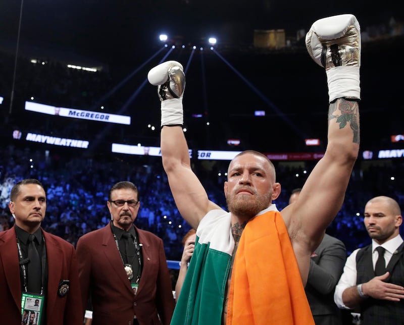 Conor McGregor reacts before a super welterweight boxing match against Floyd Mayweather in Las Vegas. AP