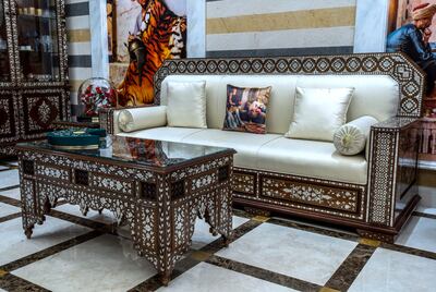 Some of the most striking furniture in the house are the pieces in the liwan, or grand hall, custom-made by artisans in Damascus. Victor Besa / The National