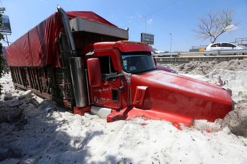 A truck is buried in ice after a heavy storm of rain and hail which affected Guadalajara, Mexico
. Reuters