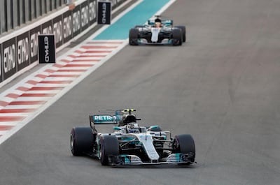 Formula One - Abu Dhabi Grand Prix - Yas Marina circuit, Abu Dhabi, United Arab Emirates - November 26, 2017   Mercedes' Valtteri Bottas and Lewis Hamilton in action during the race   REUTERS/Ahmed Jadallah