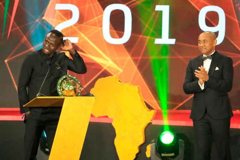 Senegal winger Sadio Mane (L) receives the award for Player of the Year from Ahmad Ahmad. AFP