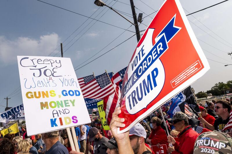 Supporters of Democratic presidential nominee and former Vice President Joe Biden and President Donald Trump rally outside the Wisconsin Aluminum Foundry on September 21, 2020 in Manitowoc, Wisconsin.  AFP