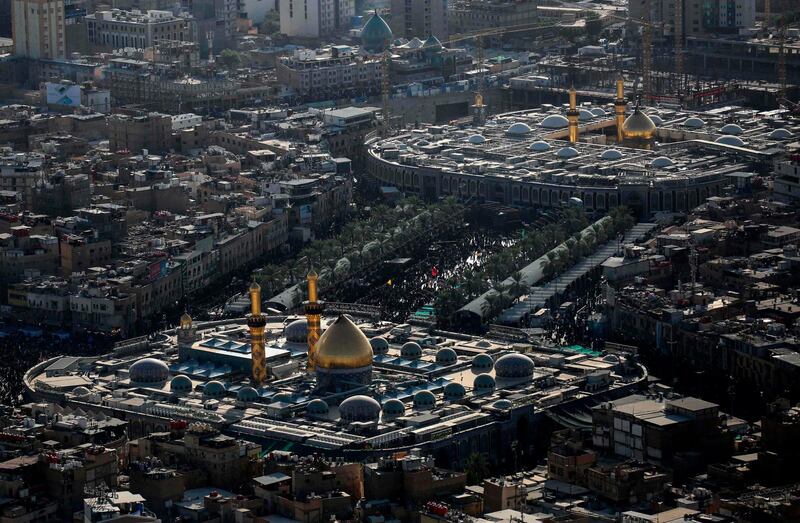An aerial picture taken during an Iraqi army helicopter tour shows the shrines of Imam Hussein (top) and Imam Al-Abbas in Iraq's central holy city of Karbala, as Shiite pilgrims gather a day ahead of Arbaeen, marking the end of the 40-day mourning period for the seventh century killing of Imam Hussein, Prophet Mohammed's grandson.  AFP