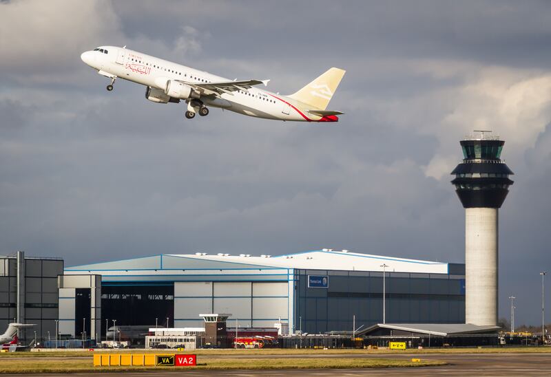 A Libyan Airlines Airbus A320 taking off from Manchester Airport. Alamy