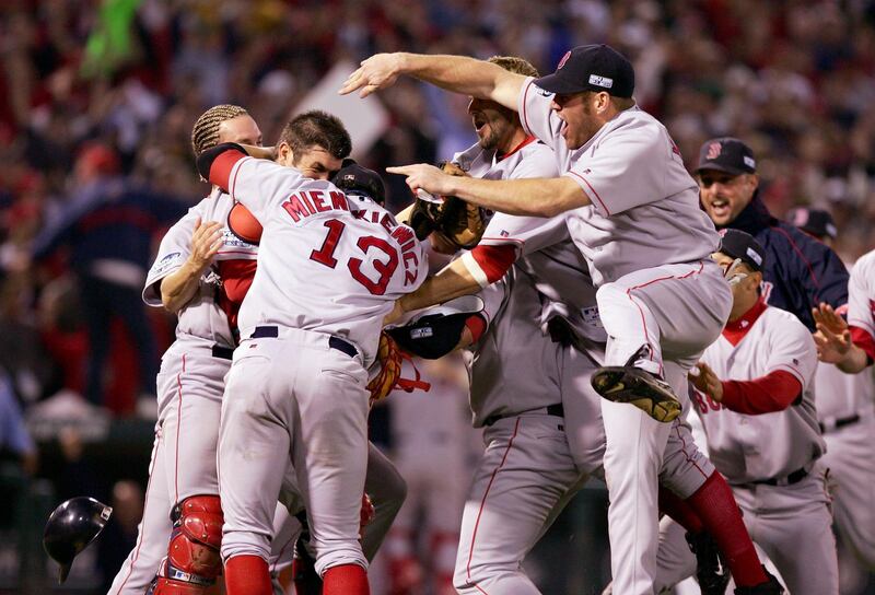 ST LOUIS - OCTOBER 27:  The Boston Red Sox celebrate after defeating the St. Louis Cardinals 3-0 in game four of the World Series on October 27, 2004 at Busch Stadium in St. Louis, Missouri.(Photo by Jed Jacobsohn/Getty Images)