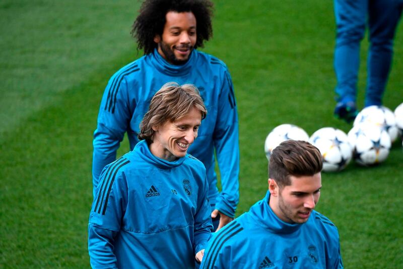 Real Madrid defender Marcelo (back), midfielder Luka Modric, centre, and goalkeeper Luca Fernandez during a training session. Gabriel Bouys / AFP