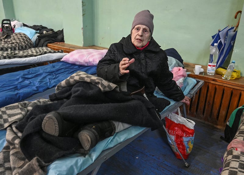 Zinaida Bogdanova, a resident of the Ukrainian city of Mariupol, reacts as she stays at a temporary accommodation centre for evacuees located in the building of a local sports school in Taganrog in the Rostov region, Russia. Reuters