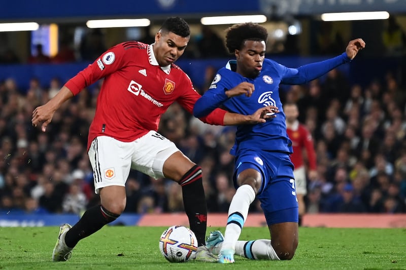 Manchester United's Brazilian midfielder Casemiro vies for the ball with Chelsea's Carney Chukwuemeka at Stamford Bridge on Saturday, October 22, 2022. AFP