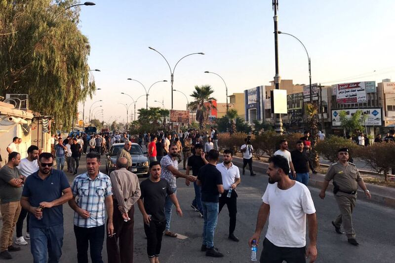 Iraqi protesters block a road following protests in the multi-ethnic Iraqi city of Kirkuk on September 2, 2023.  At least one civilian was killed and eight people were injured in the city of Kirkuk, as authorities imposed a curfew after days of tensions.  (Photo by AFP)