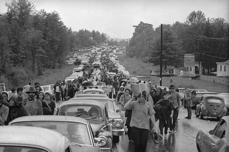Hundreds of fans jam a highway as they try to leave the Woodstock Music Festival. AP Photo