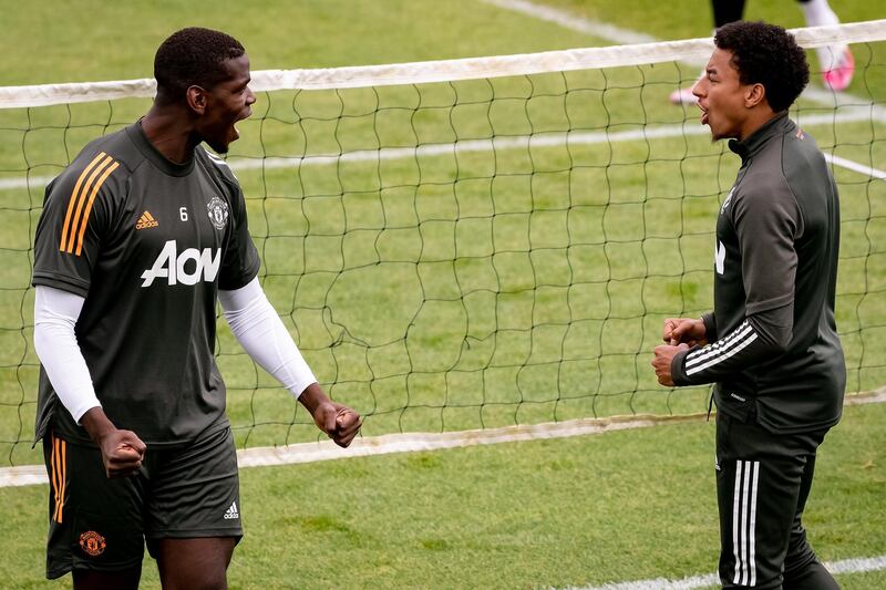 MANCHESTER, ENGLAND - JULY 24: (EXCLUSIVE COVERAGE) Paul Pogba and Jesse Lingard of Manchester United in action during a first team training session at Aon Training Complex on July 24, 2020 in Manchester, England. (Photo by Ash Donelon/Manchester United via Getty Images)