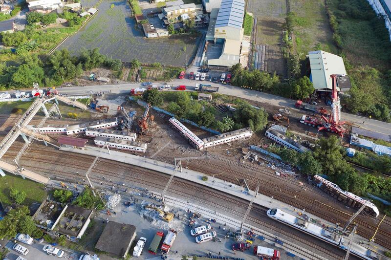 Carriages of the Puyuma Express train in Taiwan's northeastern Yilan county, a day after the train derailed at high speed near Xinma station. .  AFP