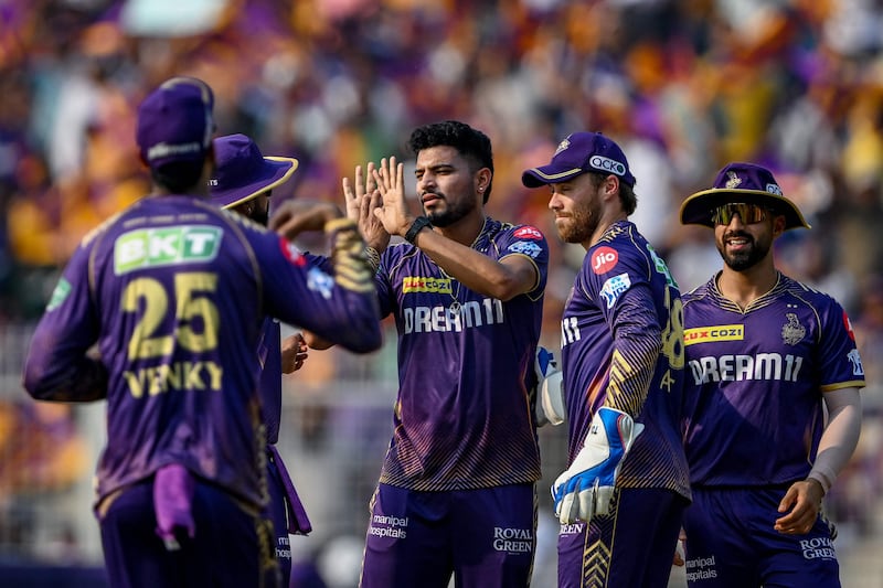 Kolkata Knight Riders' Vaibhav Arora, centre, celebrates with teammates after taking the wicket of Lucknow Super Giants' Quinton de Kock. AFP