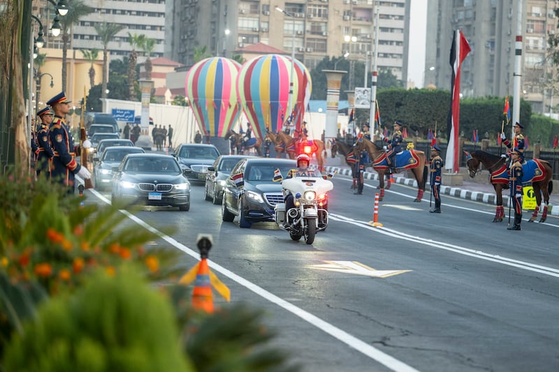 Sheikh Mohamed travels by motorcade to a reception hosted by Mr El Sisi. Photo: Hamad Al Kaabi / UAE Presidential Court 