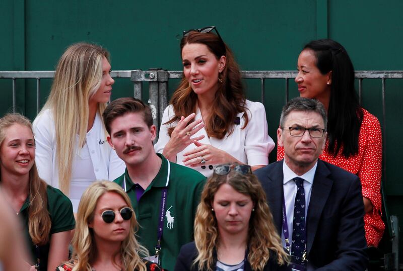 Kate Middleton, Duchess of Cambridge, sits with former British tennis player Anne Keothavong, right, and current player Katie Boulter during the first-round match between Britain's Harriet Dart and Christina McHale of the US. Reuters