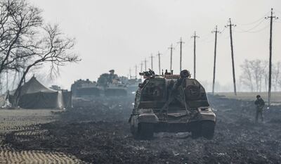 Russian armoured vehicles stand on the road in the Rostov region of Russia. EPA