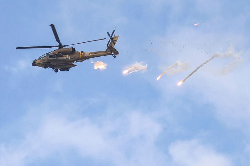 An Israeli Air Force AH-64 Apache attack helicopter releases a payload over Jenin during the raid. AFP