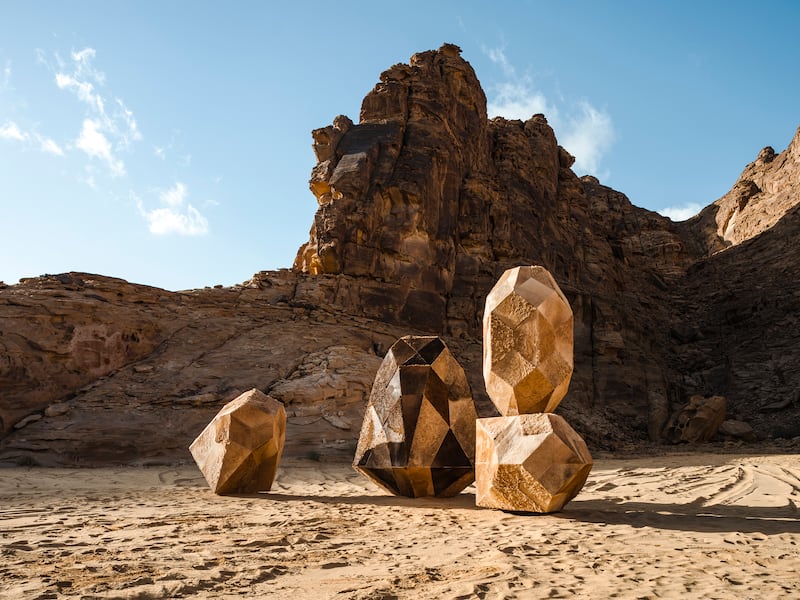 Zeinab AlHashemi's 'Camouflage 2.0' uses discarded camel skins on an abstract, geometric base, resembling a rock formation in the desert.