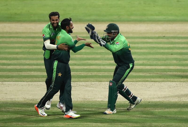 ABU DHABI, UNITED ARAB EMIRATES - OCTOBER 16: Mohammad Hafeez of Pakistan celebrates with teammates after dismissing Thisara Perera of Sri Lanka during the second One Day International match between Pakistan and Sri Lanka at Zayed Cricket Stadium on October 16, 2017 in Abu Dhabi, United Arab Emirates.  (Photo by Francois Nel/Getty Images)